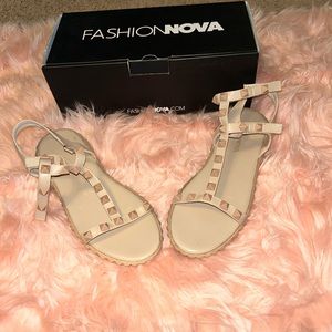 Flat sandals, only worn once. Good condition, comes with box. Nude color.